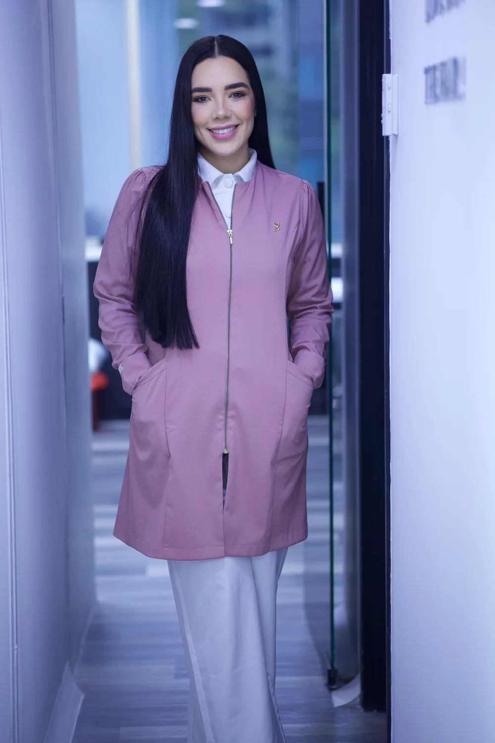 Dr. Daniela Díez in a pink coat